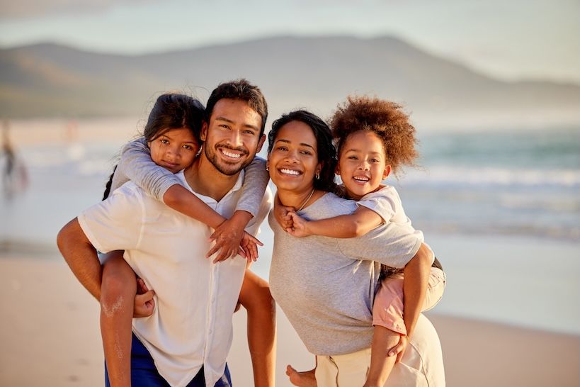 Family of four on the beach