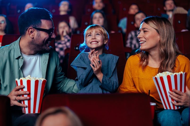 Family of three at the movies